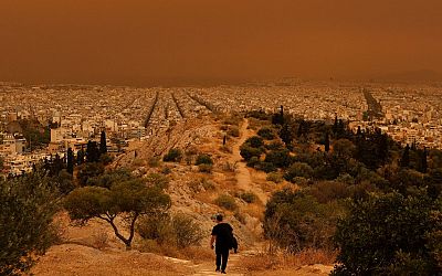 Greece: Athens turns orange as Sahara dust storm sweep across city I VIDEO