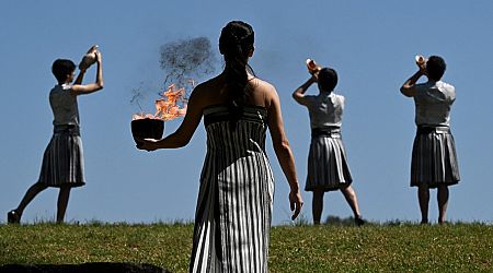 Paris flame lit in ancient Olympia ceremony, starting torch relay to France