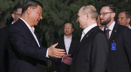 Xi and Putin go in for TWO hugs...