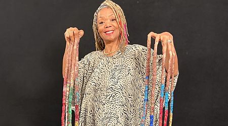 Woman with world's longest nails has toilet struggles but shares sad reason for not cutting them