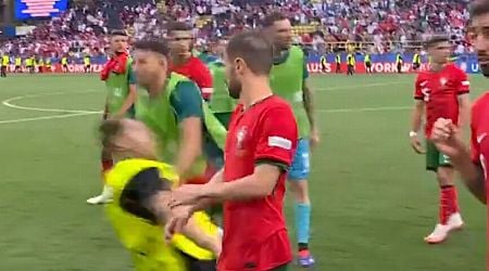 Euro 2024 security slammed as Portugal star wiped out while Cristiano Ronaldo fan tackled