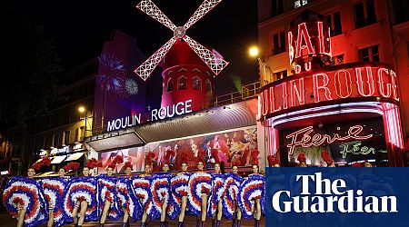 Moulin Rouge in Paris celebrates installation of new windmill sails