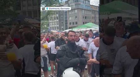 English fans sing to German police officer who looks like Southgate