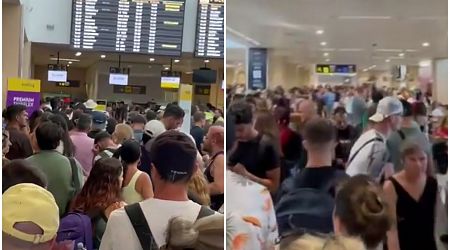 Travel chaos in Spain: At least 105 flights are cancelled as tourists report hours-long delays at major airports following Microsoft crash