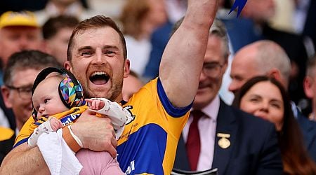 Seadna Morey celebrates Clare's All-Ireland win by lifting Liam MacCarthy Cup with baby daughter