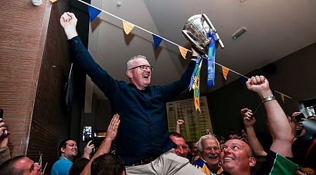 Clare manager Brian Lohan carried aloft as he brings Liam MacCarthy Cup to home club 
