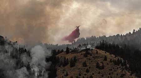 Western U.S. battles massive wildfires triggering evacuations, health alerts
