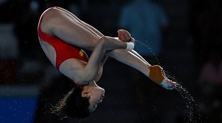 Quan retains diving title, multiple new records created