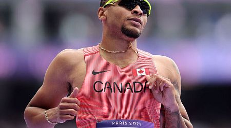 Reigning champ De Grasse out of 200m final while Lyles qualifies 3rd