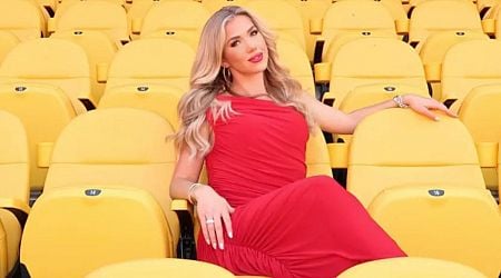 Chiefs heiress Gracie Hunt counts down to kickoff in red dress