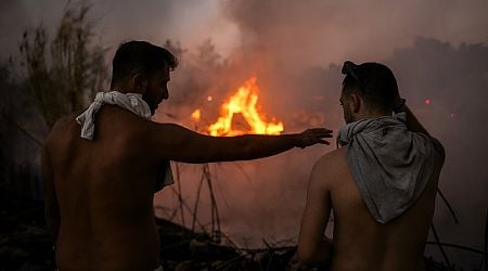 Greek firefighters calm deadly Athens inferno