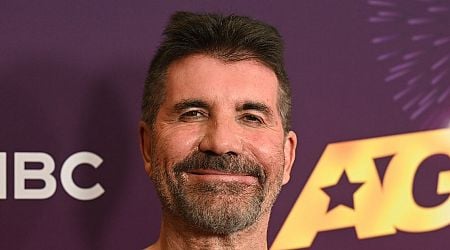 Simon Cowell looks the proud dad as he's joined by lookalike son Eric, 10, on red carpet