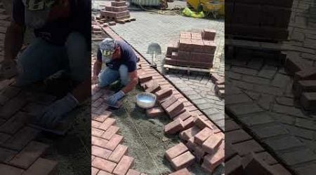 Installing bricks with masonry glue #street #Dordrecht #netherlands on