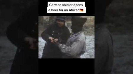 German soldier opens beer for African. #ww2 #germany #edit