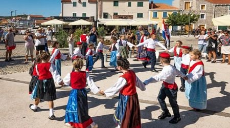 Tourists enjoy old traditions in Croatian fishing village of Betina