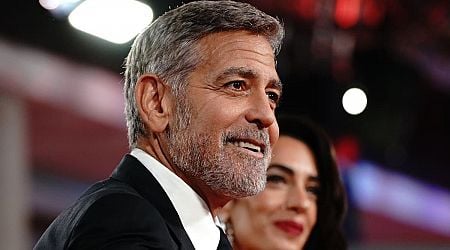 George Clooney plays photographer at star-studded charity event