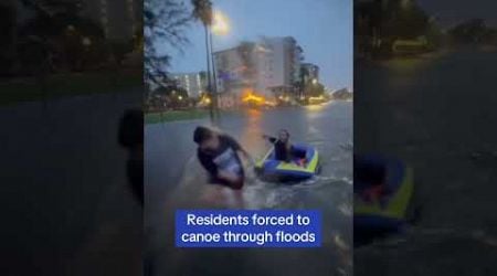 Tampa residents drag canoe through flooded streets as Hurricane Helene slams Florida