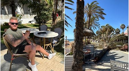 Watch: Hilarious moment relieved expat sips his beer in Marbella after almost being crushed by a falling palm tree amid severely strong winds