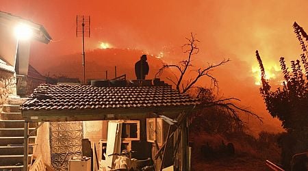 Wildfire burning through forest in southern Greece kills 2 people