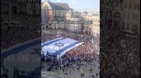 HUGE crowd in the Netherlands displays a massive Israeli flag in solidarity with the Jewish state.