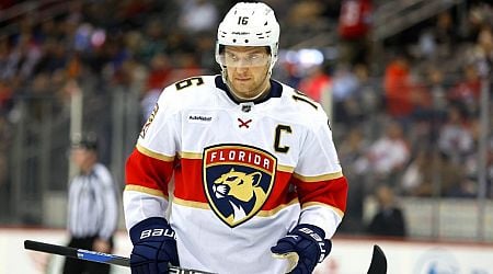 Panthers' Aleksander Barkov helped off ice after crashing into boards