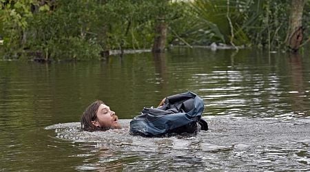 Residents slog through flooded streets, clear debris after Hurricane Milton tore through Florida