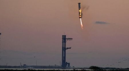 Launch tower's 'chopsticks' catch descending rocket booster as SpaceX launches Starship