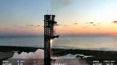 Mechanical SpaceX arms catch returning Starship rocket booster at launch pad