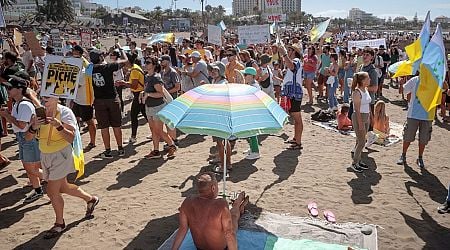 'Anti tourism' protests spread across Spain's islands with sunbathing Brits targeted on beach