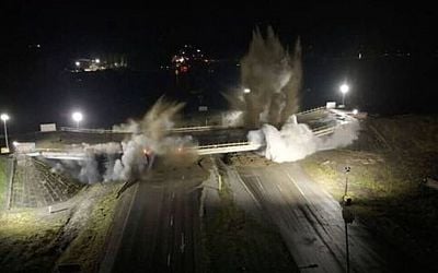 Insane moment British troops blow up highway bridge in warning to Putin...