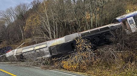 Train carrying at least 50 people derails on Norway's north coast, killing at least 1 person