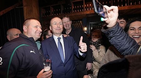 Micheal Martin enjoys a pint in Dublin pub as leaders canvass Ireland vs All Blacks rugby match