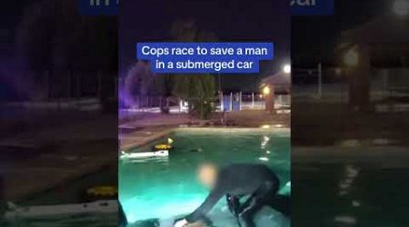 Cops RACE to save man in a submerged car