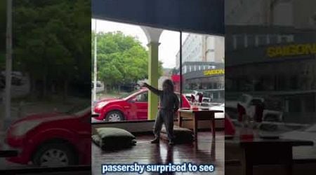 Adorable little boy greets strangers through window