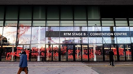 Demonstrators daub Rotterdam arms fair entrance with fake blood