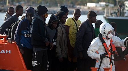 Spain will give work permits and residency to thousands of illegal migrants