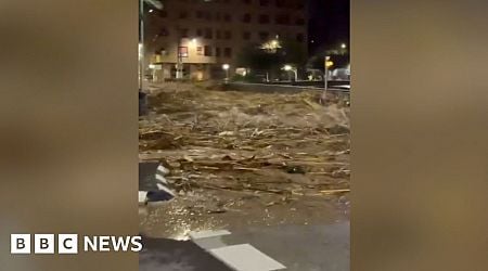 Watch first wave of flood water gushing through town in Valencia