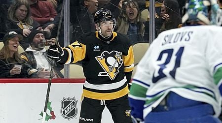 Rust helps Penguins beat Canucks 5-4 to snap three-game skid