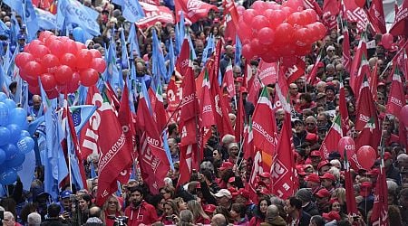 Thousands of workers march across Italy in general strike demanding better pay and services