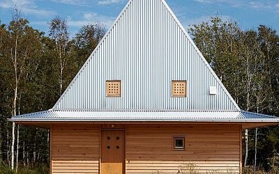 This Little Wooden Cabin On The Swedish Coast Boasts An Unusual Hat-Shaped Metal Roof