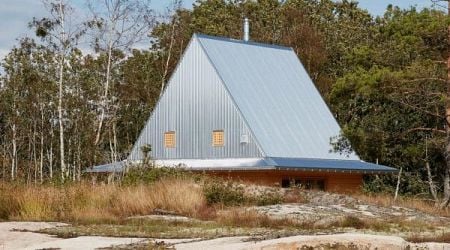 Hat-shaped metal roof shelters Hee House by Studio Ellsinger