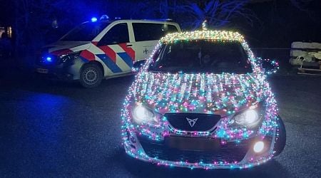 Police stop car fully covered in bright Christmas lights 