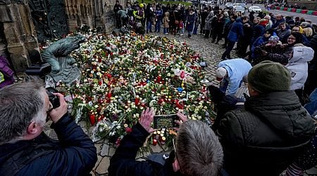 Germans mourn the 5 killed and 200 injured in the apparent attack on a Christmas market