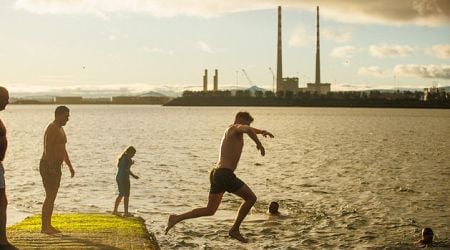 Sunshine and mild temperatures for Christmas swimmers as thousands take the plunge across the country