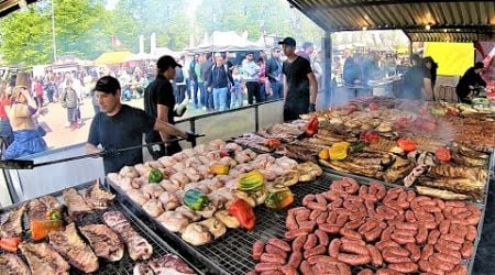 Street Food Fest in Milano, Italy. Grilled Meat, Burgers, Roasted and Pulled Pork, Pasta, Cheese