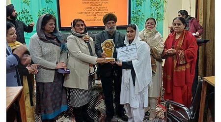 Chief guest, Dr Arvinder Singh Aman felicitating winner of quiz competition in Jammu on Saturday.