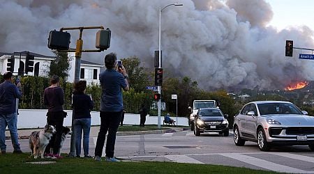 Raging wildfire engulfs upscale area near Los Angeles and triggers evacuations