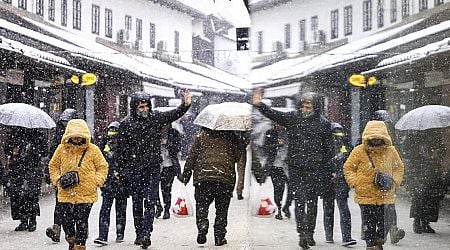 Rescuers reach a stranded hiker in Slovenia but another is missing during a Balkans snowstorm