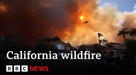 California wildfire rips through LA suburbs as 30,000 told to evacuate | BBC News