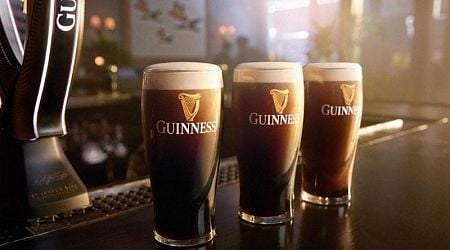 Why do bubbles in Guinness go down instead of up?